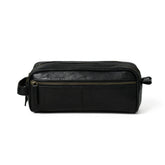 Black leather dopp kit with zipper on a white background