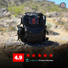 Black tactical backpack on a rock with a desert landscape in the background, featuring a brand logo and product review rating.