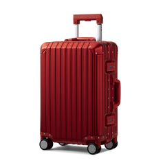 Red suitcase with a textured surface on a white background