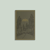 Travel journal with forest design on a light gray background