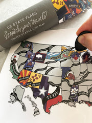 Map of the United States with state flags and a scratch-off travel map.