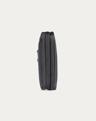 Black cylindrical object on a light gray background