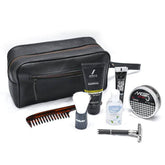 Grooming kit with black toiletry bag, comb, bottles, and other items on a white background