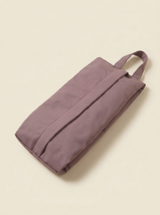 Purple tote bag on a beige background