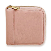 Pink wallet with gold zipper on a white background