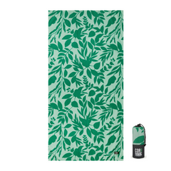 Green leaf patterned towel with a black and green bag on a white background