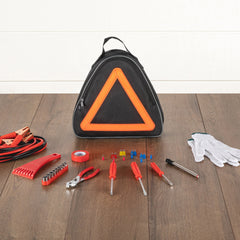Car emergency tool kit with triangle sign on a wooden floor