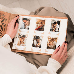 Up close view of hands holding photo album