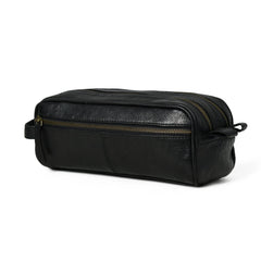 Black leather toiletry bag with gold zipper on a white background