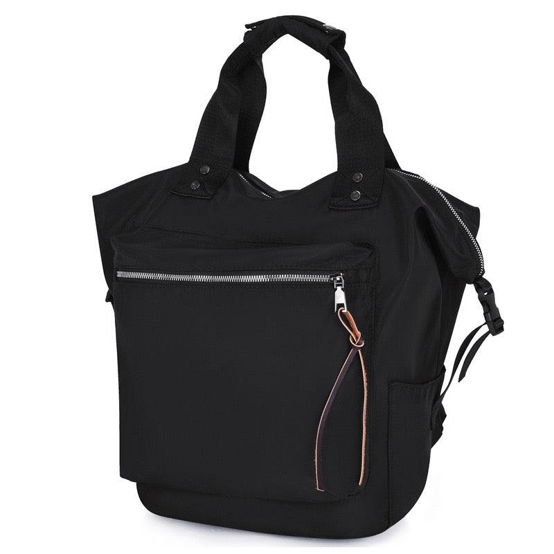 Black handbag with a shoulder strap on a white background