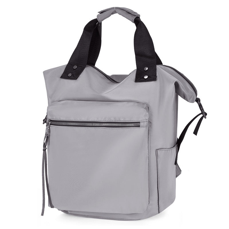 Gray backpack with black straps on a white background