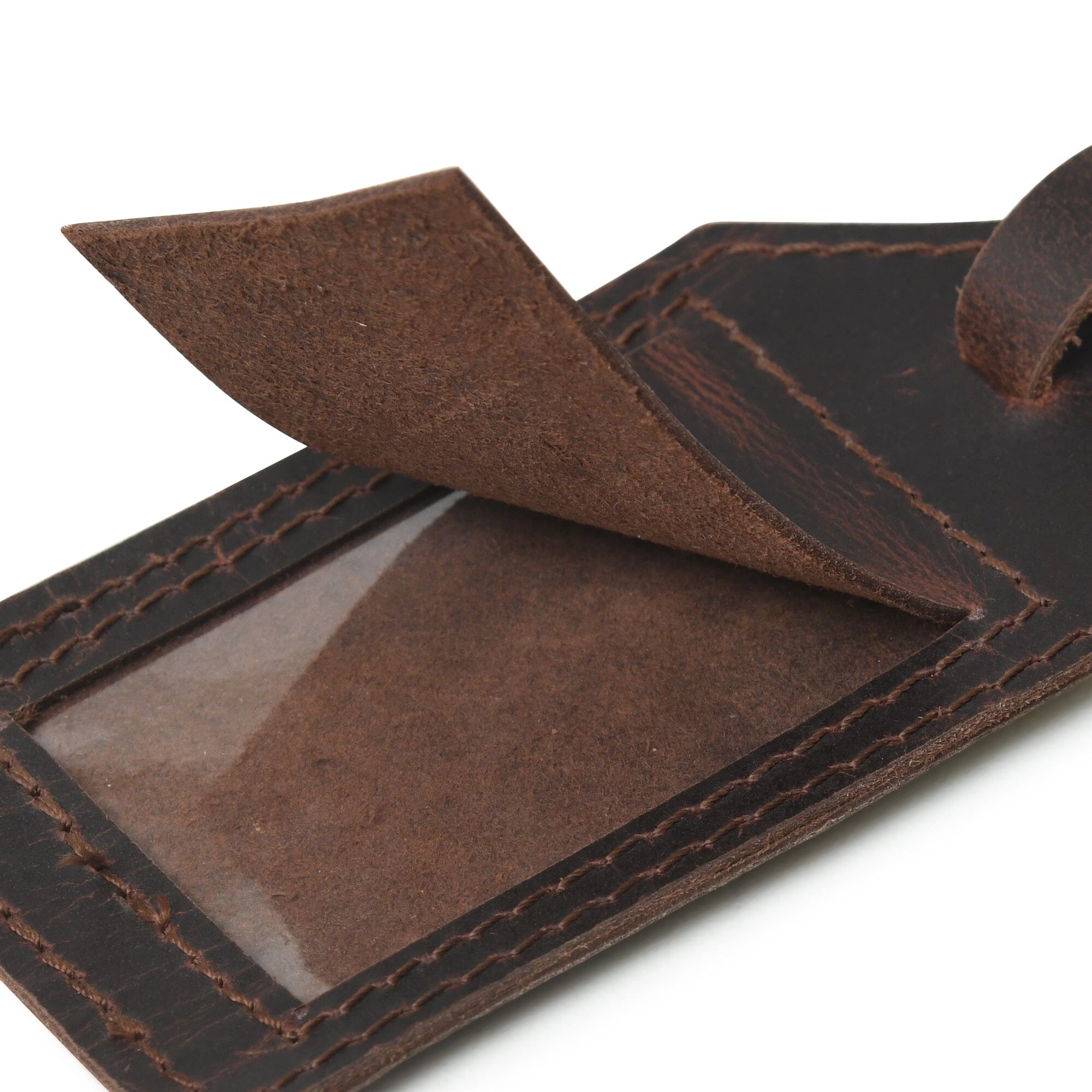 Close-up of a brown leather wallet with a clear card holder on a white background