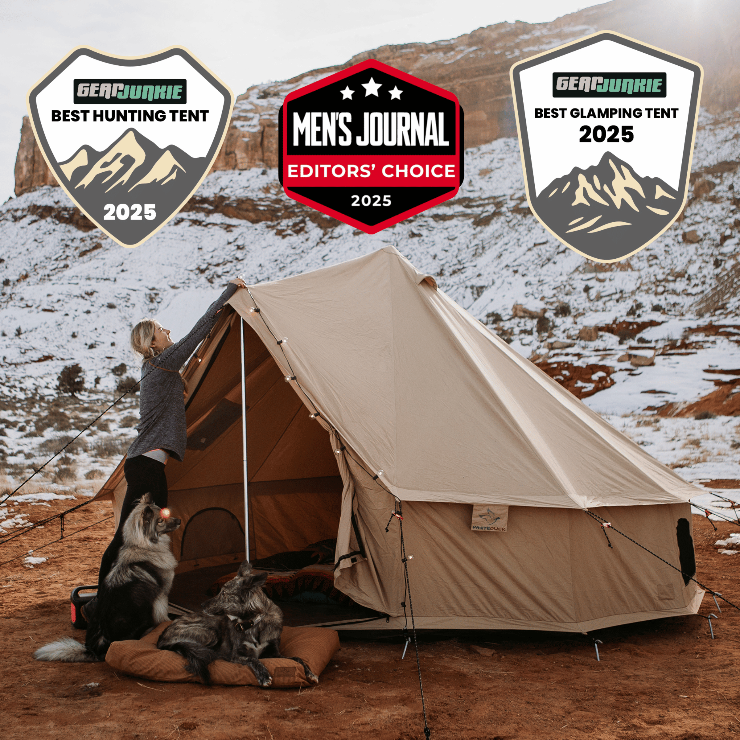 Beige camping tent in a snowy mountain landscape with awards displayed.