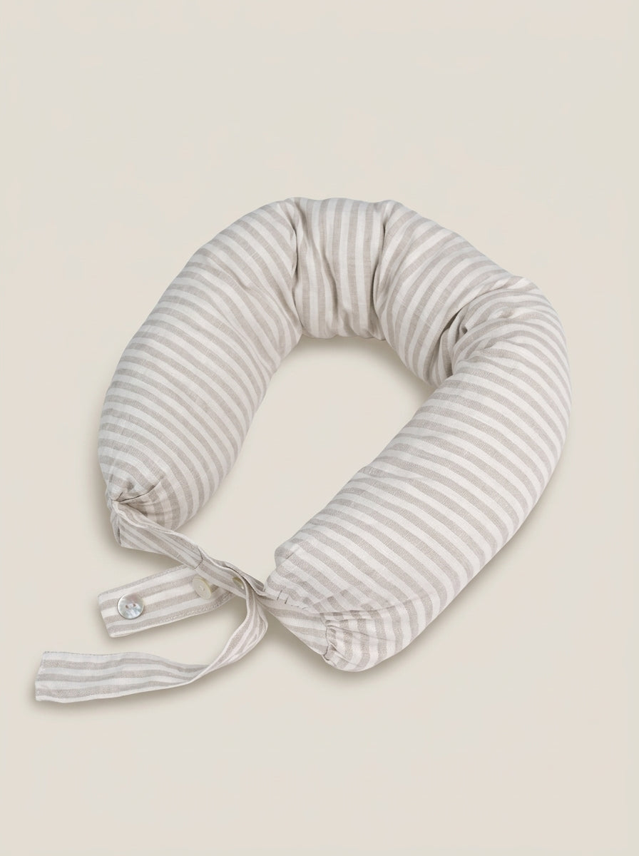 Striped neck pillow on a beige background