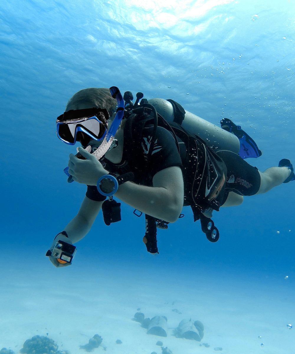 Scuba diver underwater with clear blue water