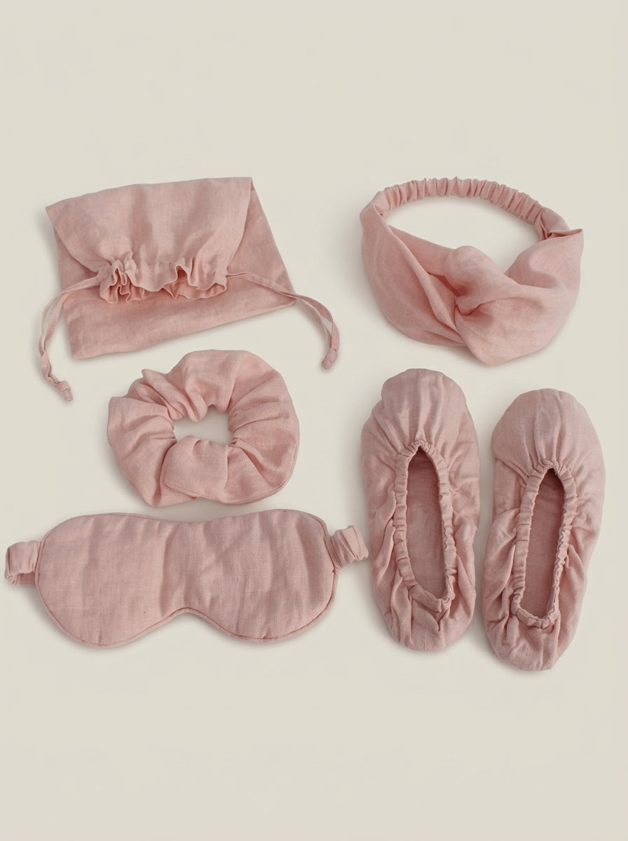 Set of pink accessories including socks, headbands, and a scrunchie on a white background.