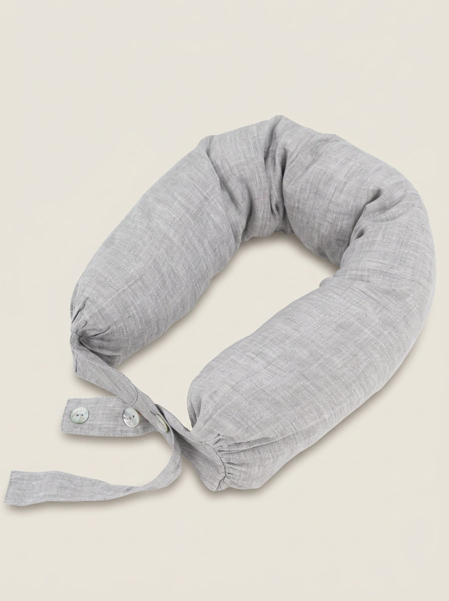 Gray neck pillow on a beige background