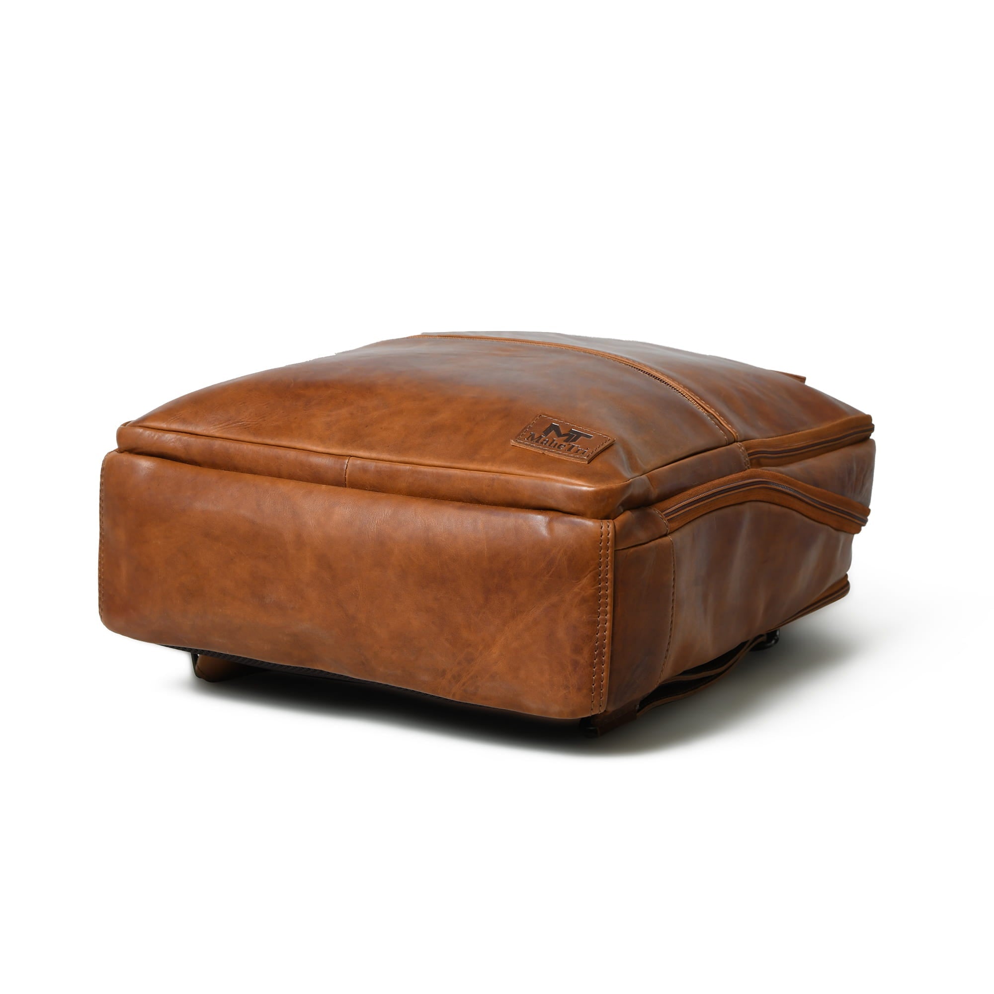 Brown leather ottoman on a white background