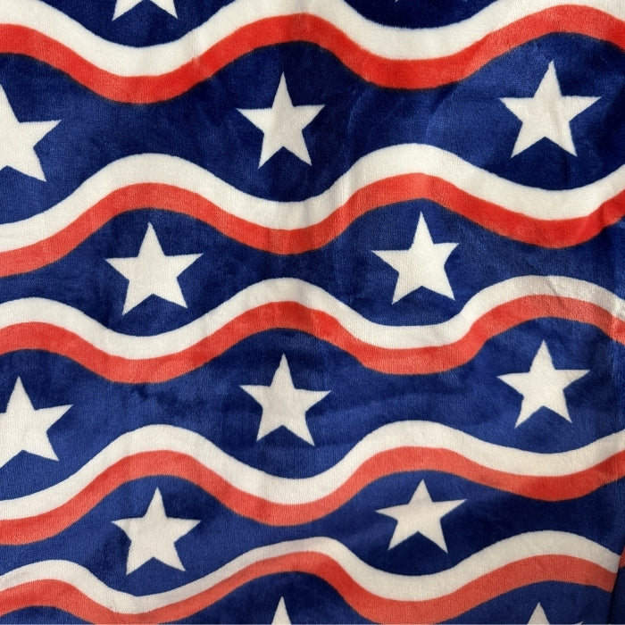 Pattern of white stars on blue background with red and white wavy lines
