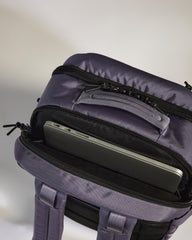 Purple backpack with a laptop compartment on a light gray background