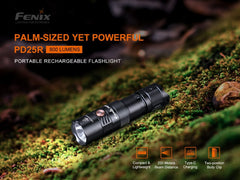 Fenix PD25R flashlight on a mossy surface with product details.