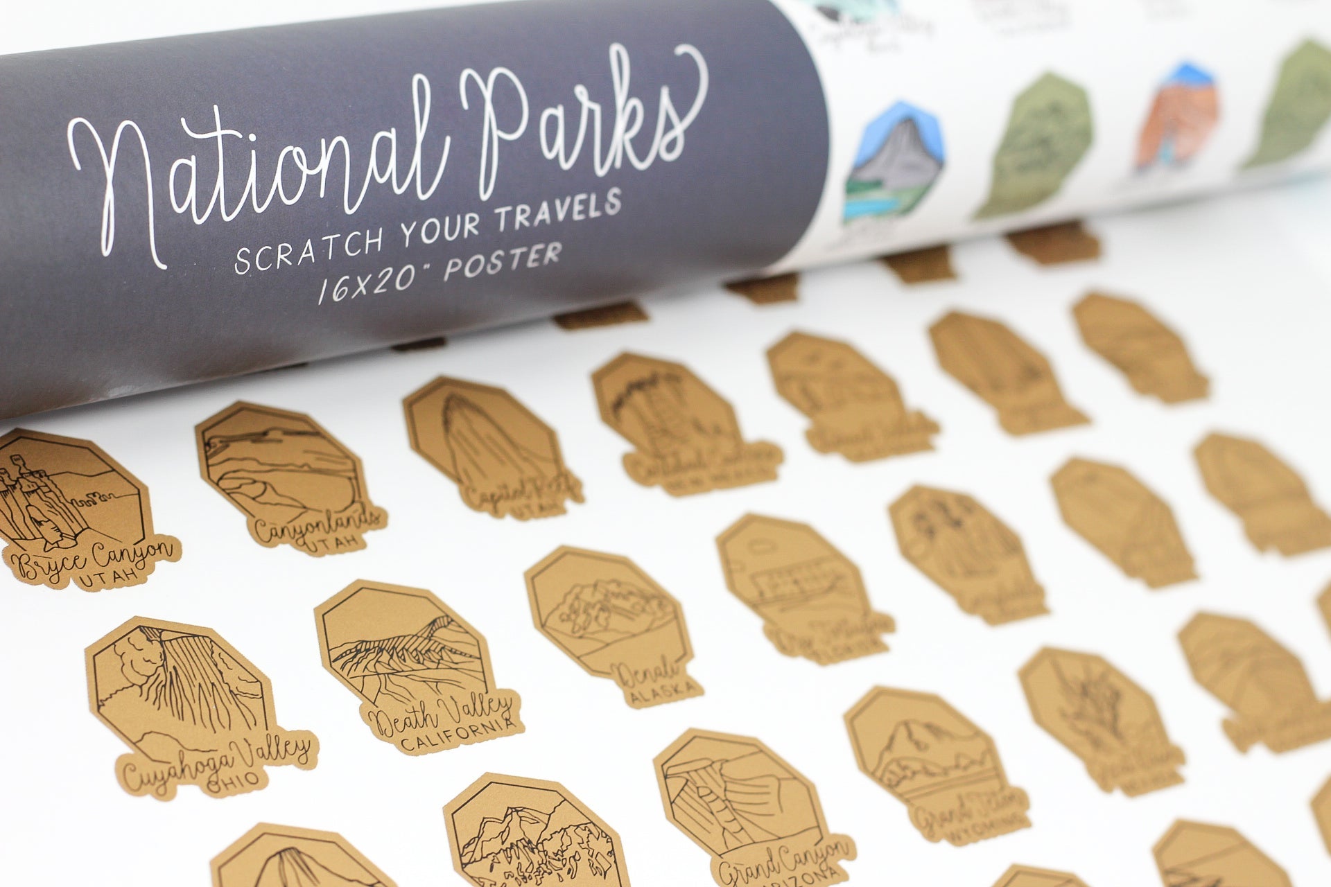 Roll of 'National Parks' scratch-off poster with various park icons on a white background