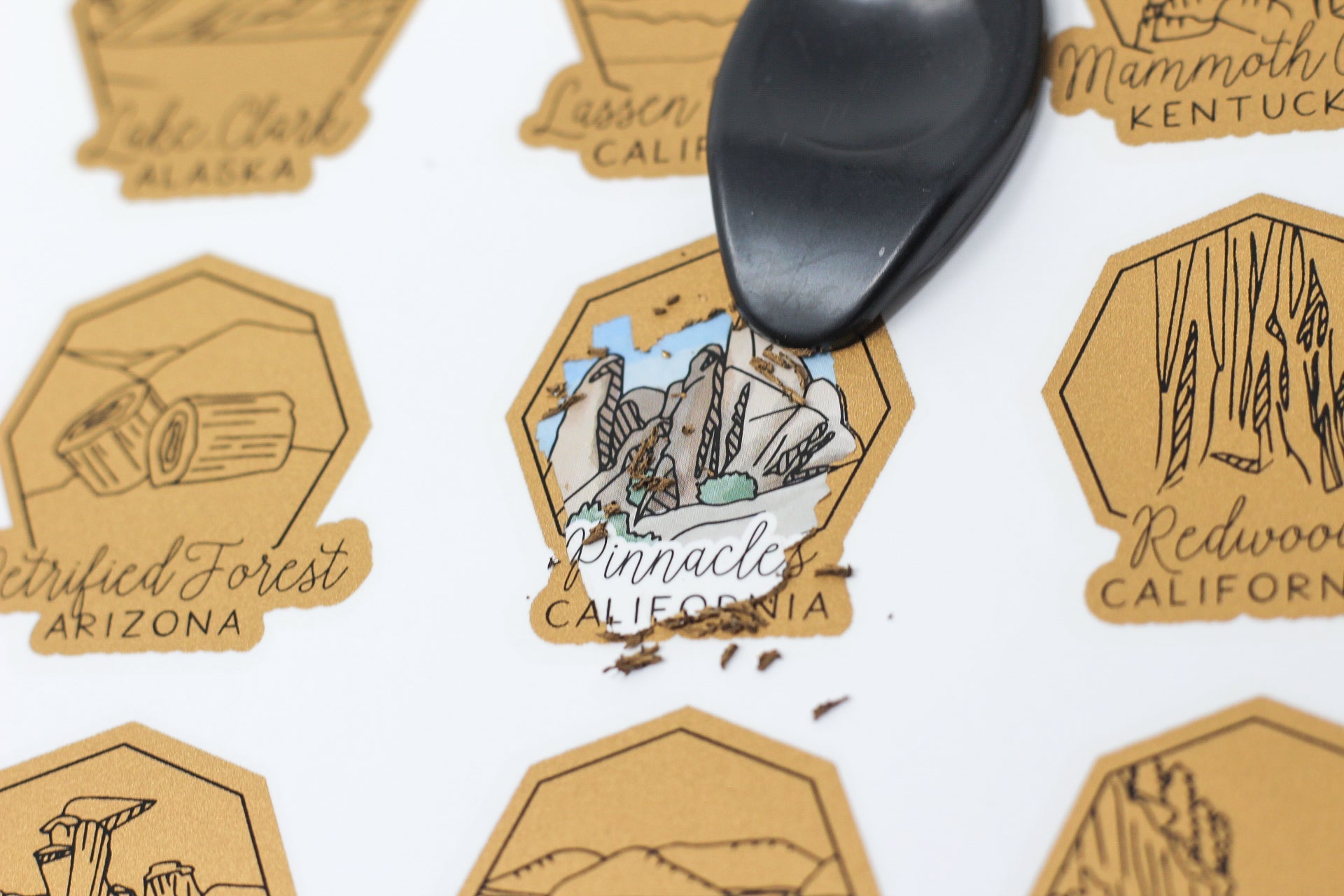 Set of travel stickers with scenic illustrations and text on a white background