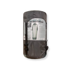 Rolled up sleeping bag in carry bag on white background