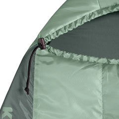 Close-up of a green tent flap with a zipper on a white background