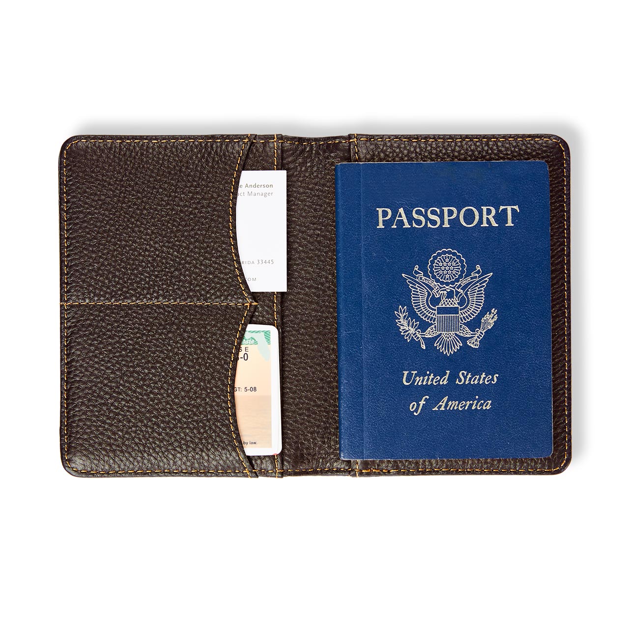 Brown leather passport holder with a blue U.S. passport inside on a white background