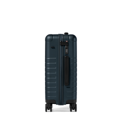 Dark blue suitcase with a black handle on a white background