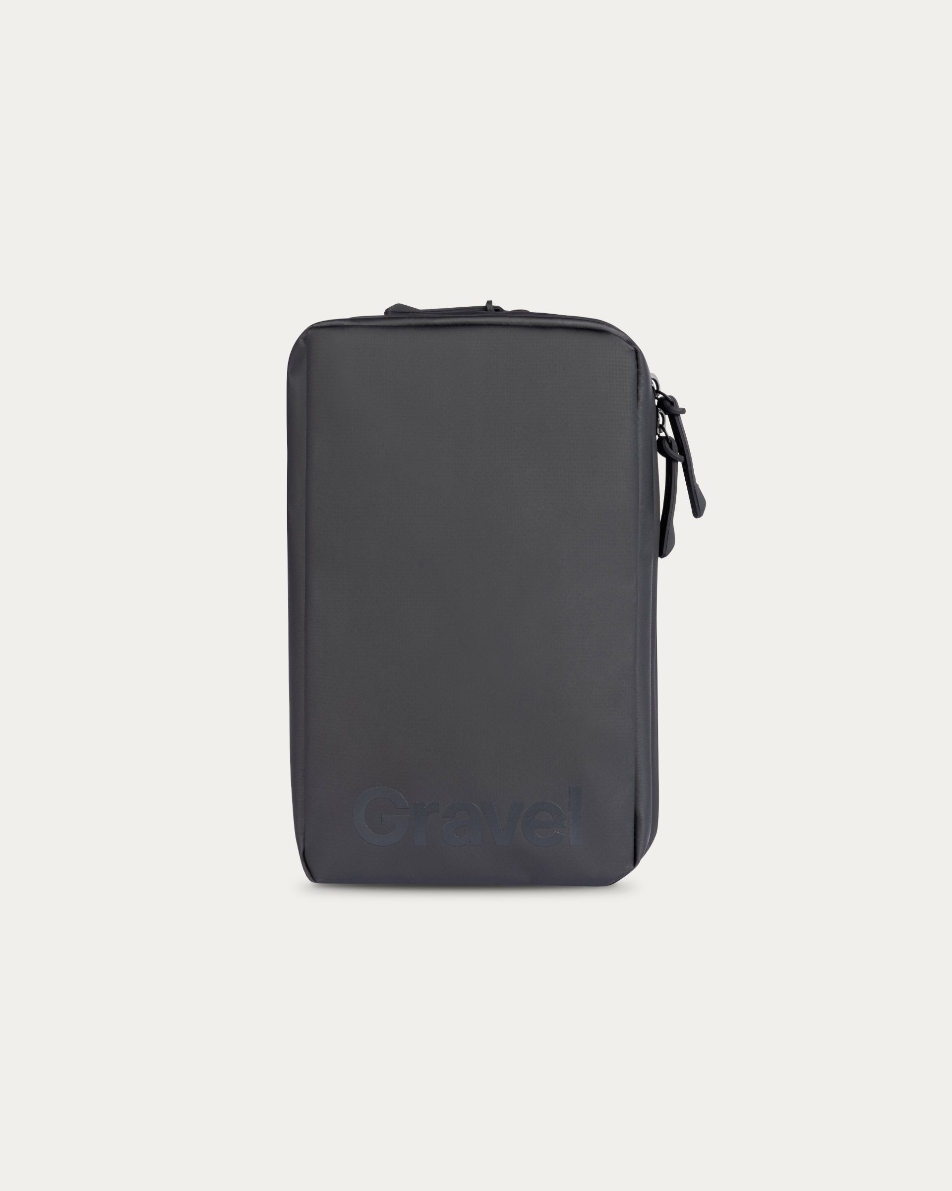 Black travel pouch on a light gray background