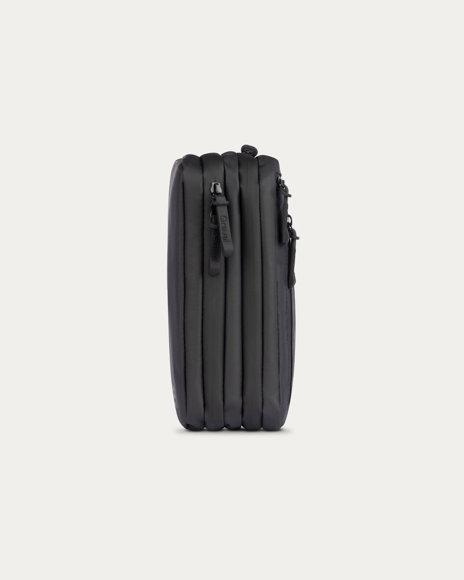 A black hard-shell suitcase shown from the side against a light gray background.