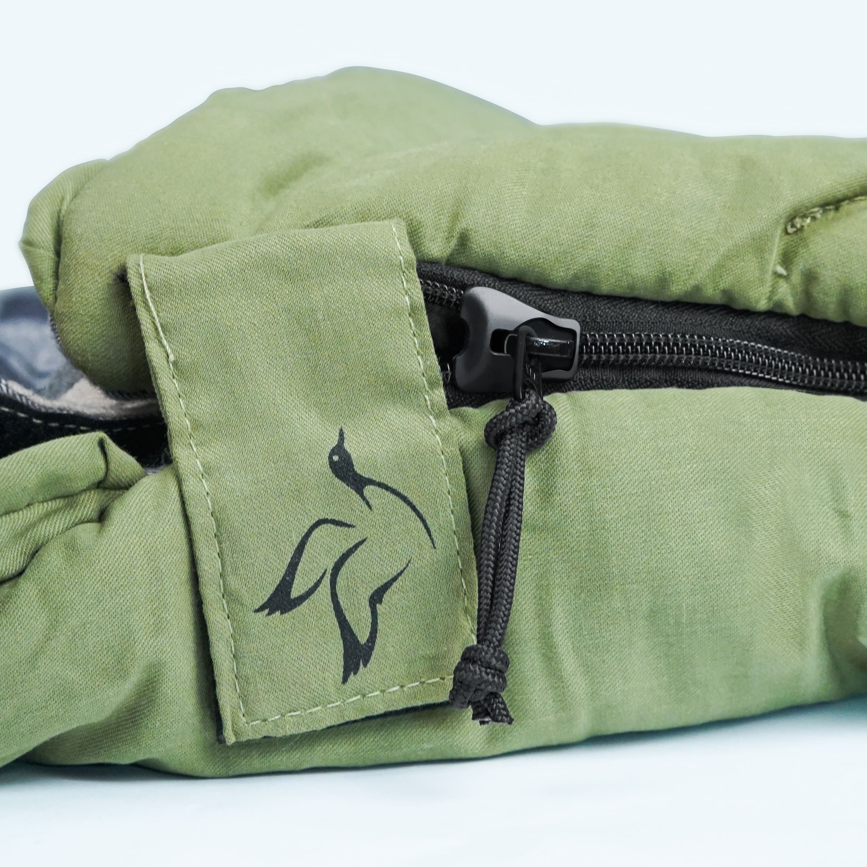 Green fabric with a black zipper and logo on a white background