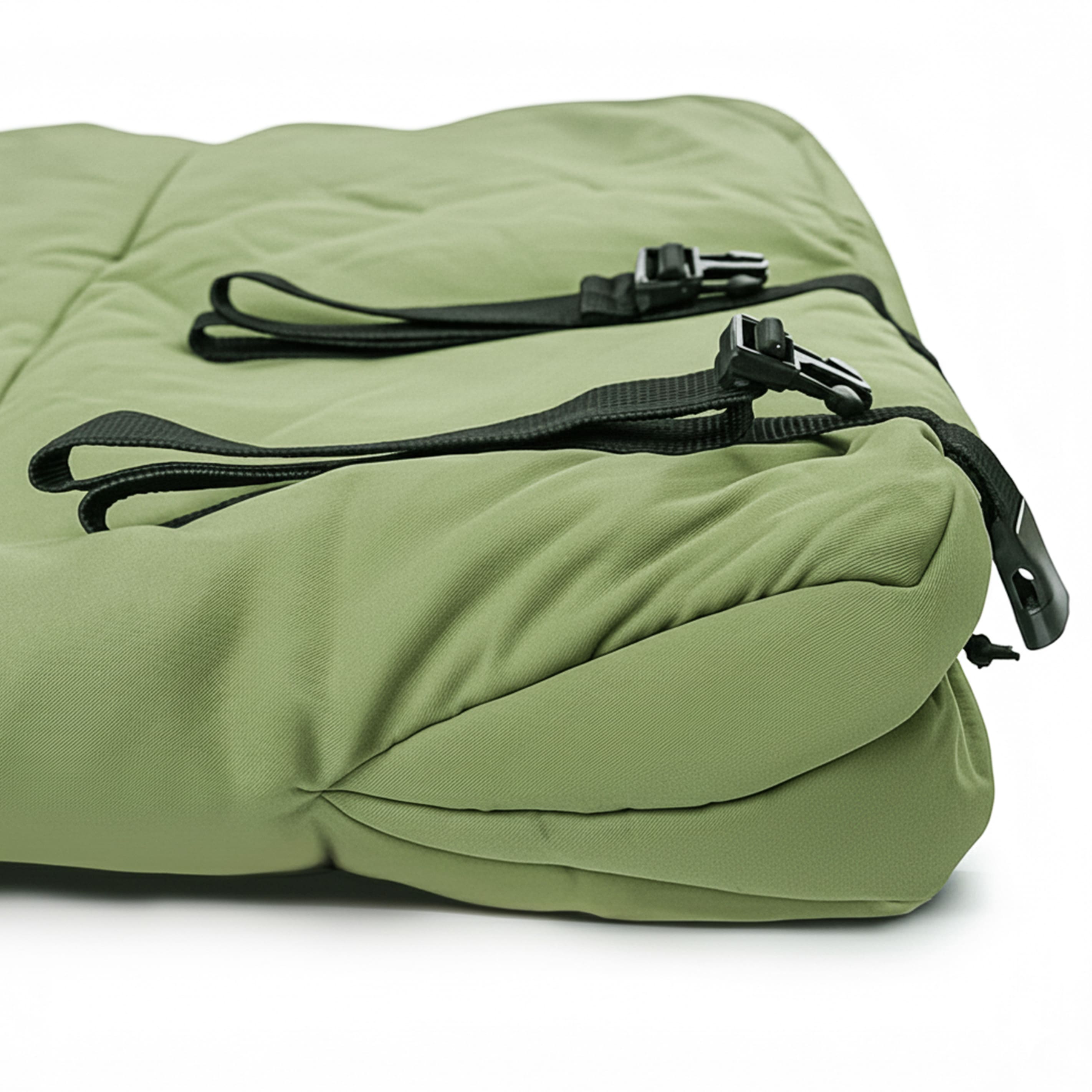 Green sleeping bag with black zippers on a white background