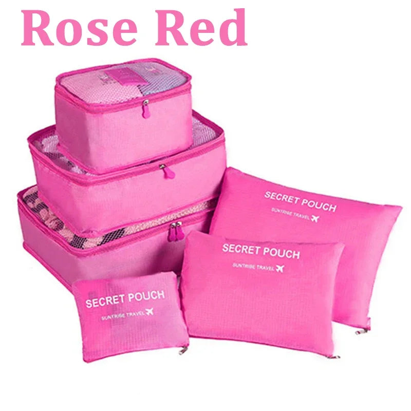 Set of pink packing cubes with 'Secret Pouch' labels on a white background