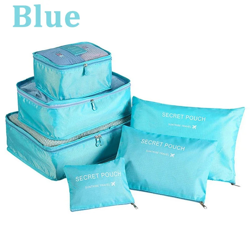 Set of blue packing cubes with 'Secret Pouch' labels on a white background