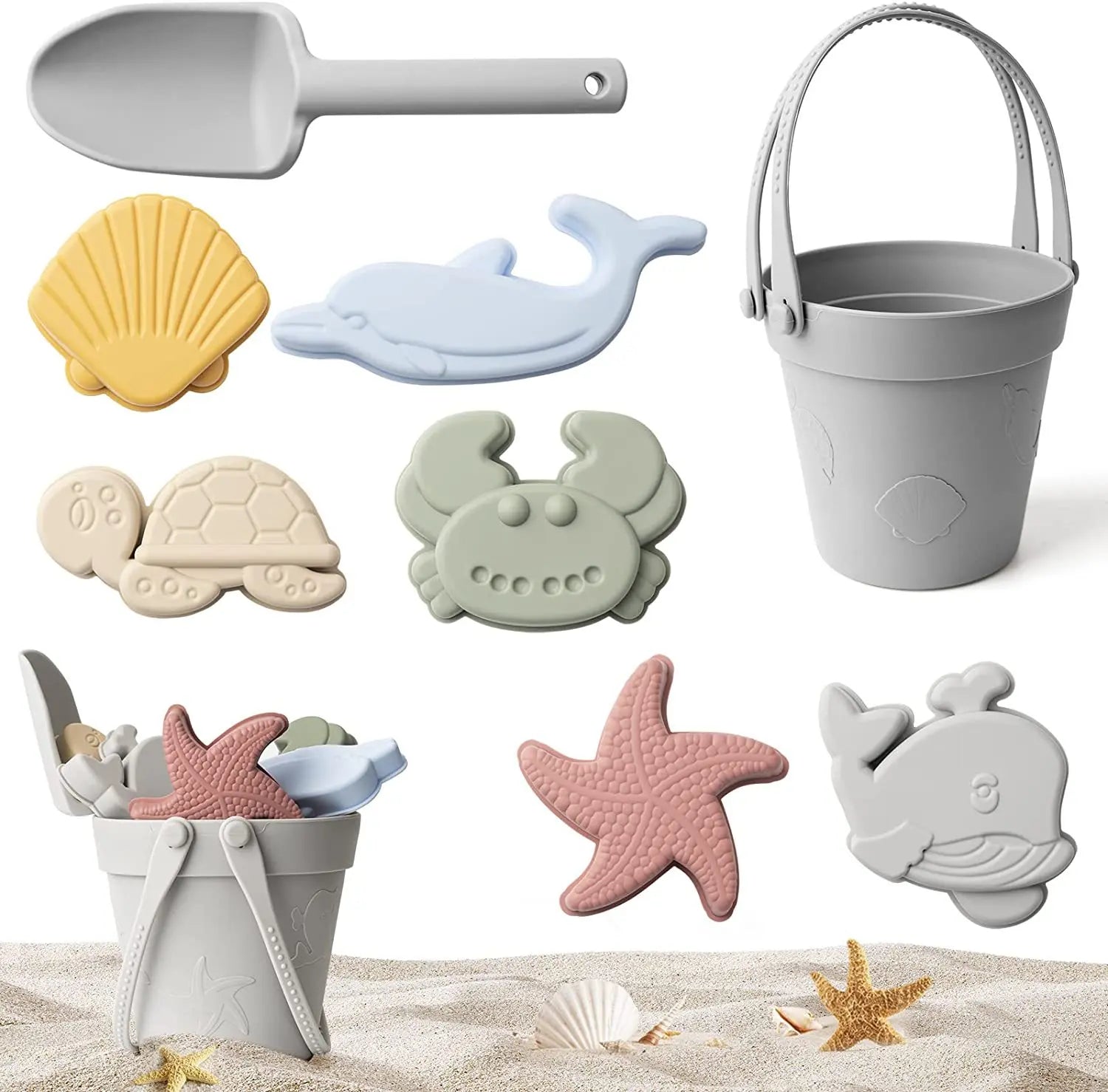 Set of beach-themed toys including a sand shovel, bucket, and various sea creature molds on a sandy background.
