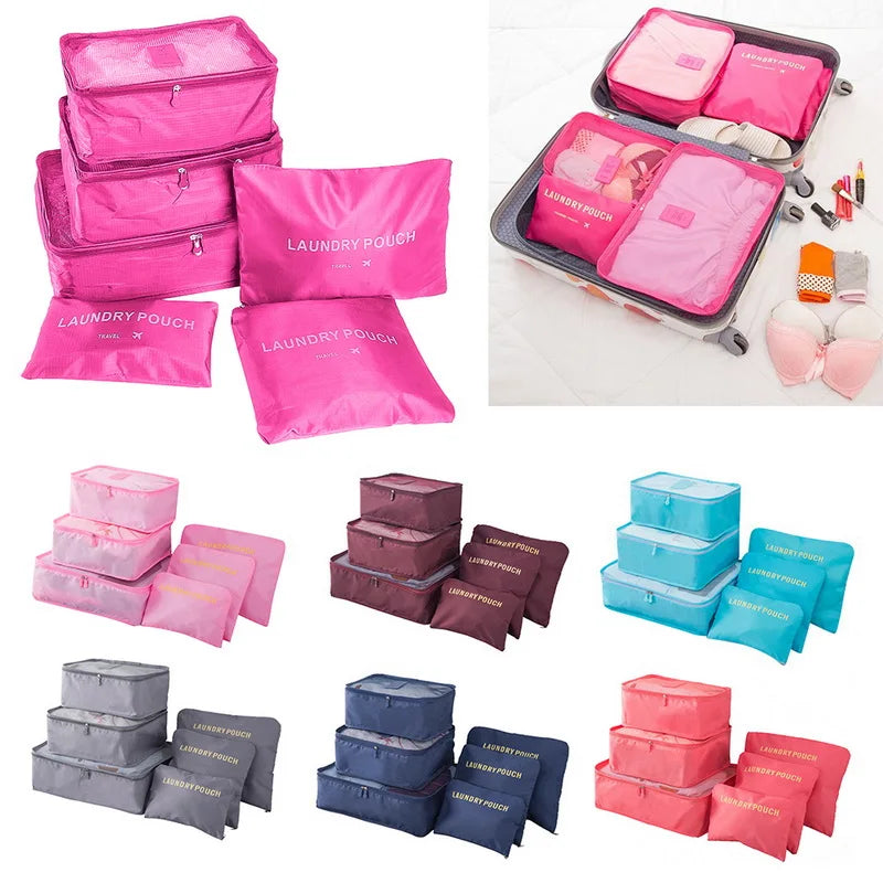 Collection of pink, purple, blue, and gray packing cubes with 'Laundry Pouch' branding.