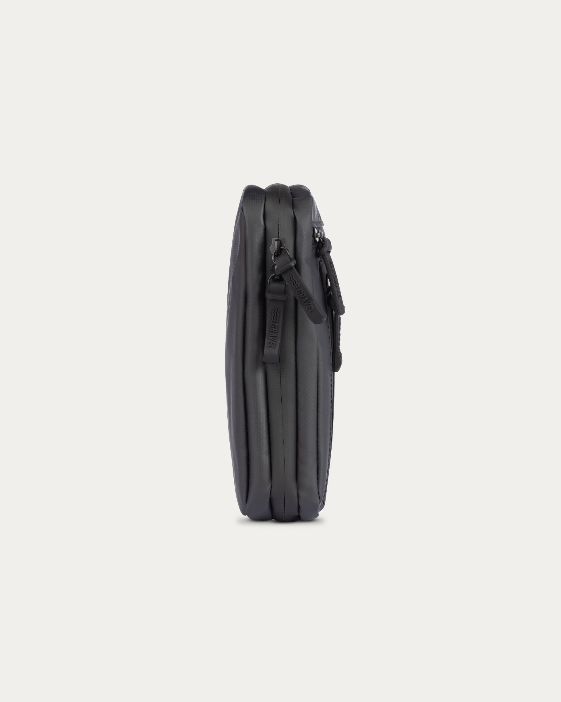 Black leather wallet with zipper on a light gray background