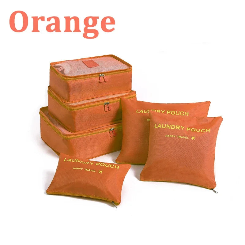 Set of orange laundry pouches with 'Happy Travel' branding on a white background.