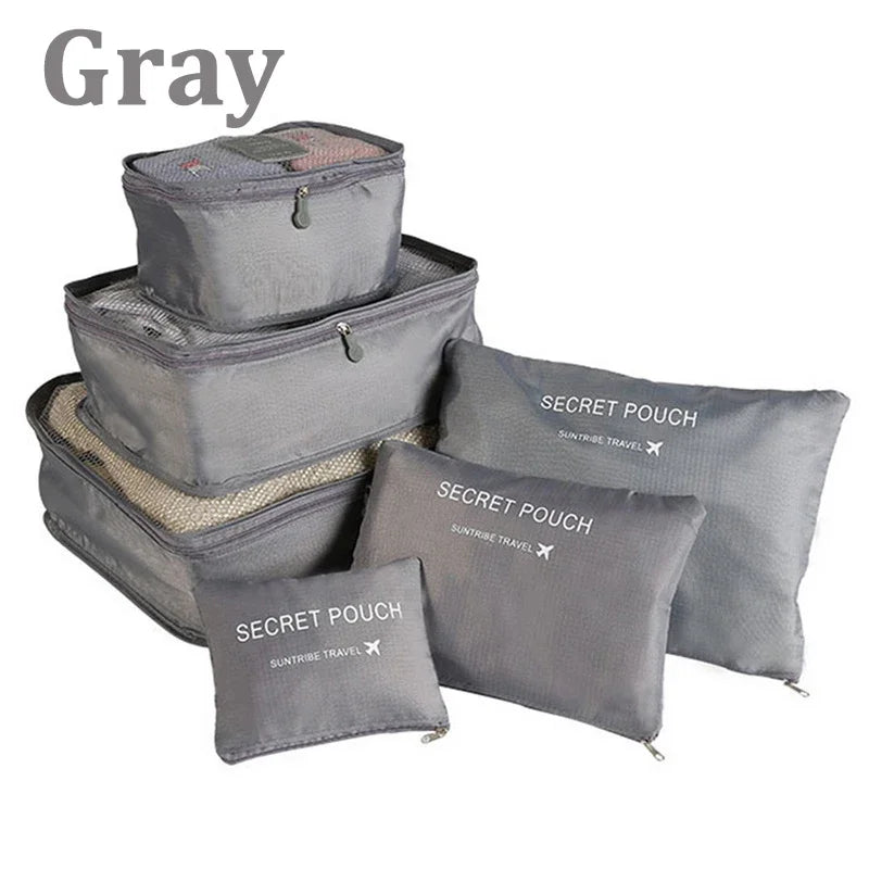 Set of gray packing cubes with 'Secret Pouch' branding on a white background