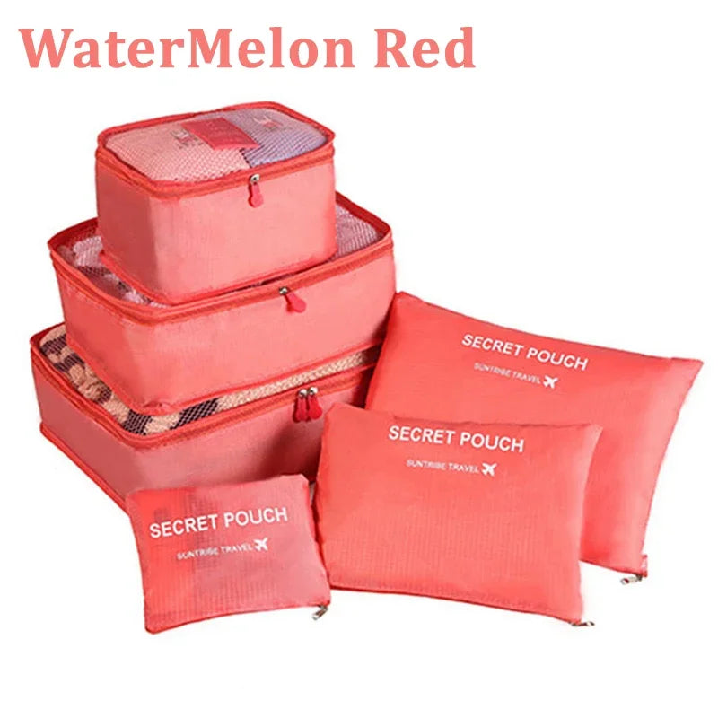 Set of red packing cubes with 'Secret Pouch' branding on a white background.