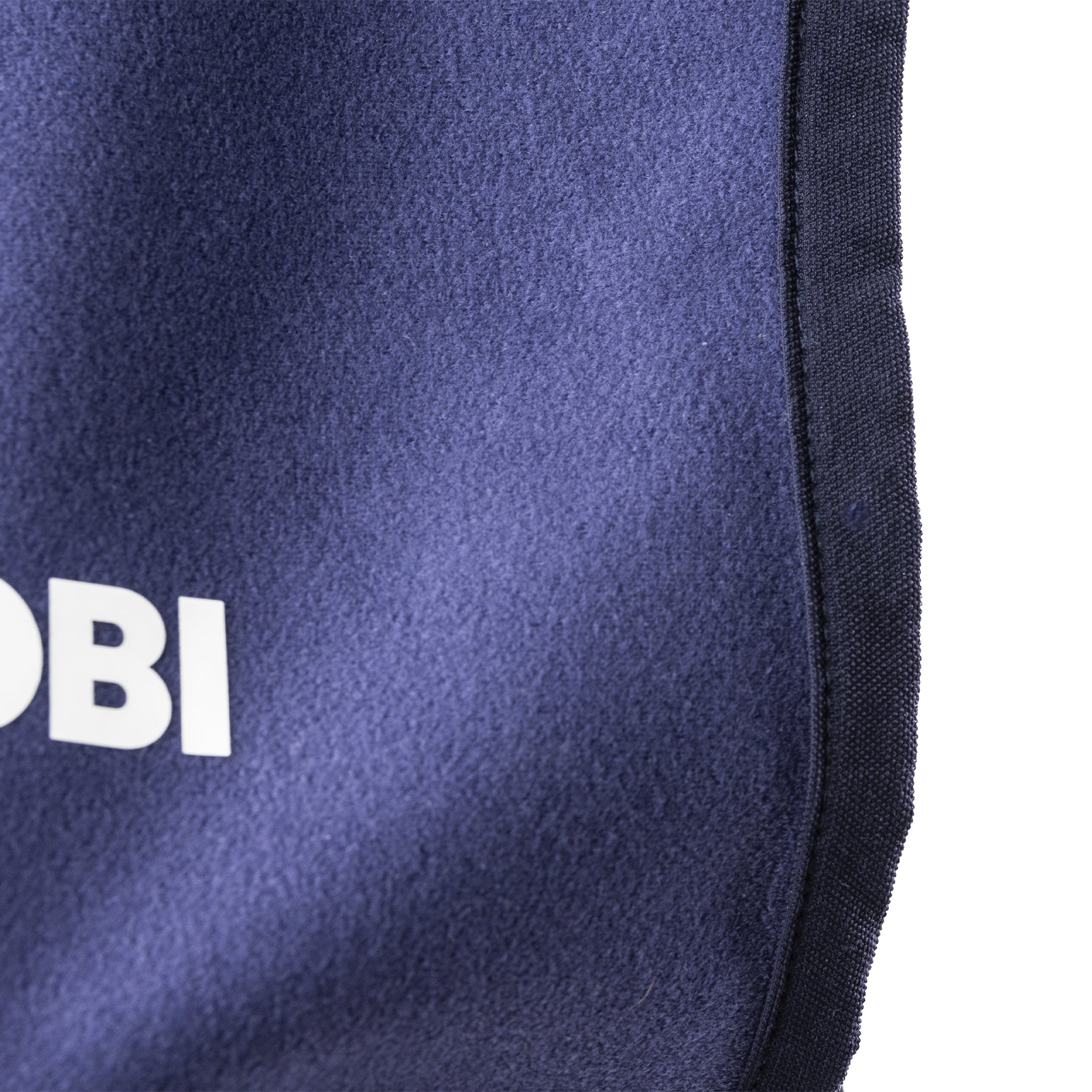 Close-up of a navy blue knee pad with 'OBO' branding on a white background