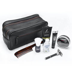 Grooming kit with black leather pouch, comb, shaving brush, bottles, and razor on a white background
