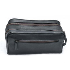 Black leather toiletry bag with multiple zippers on a white background
