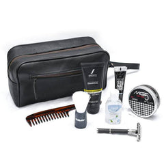 Grooming kit with black toiletry bag, comb, bottles, and other items on a white background