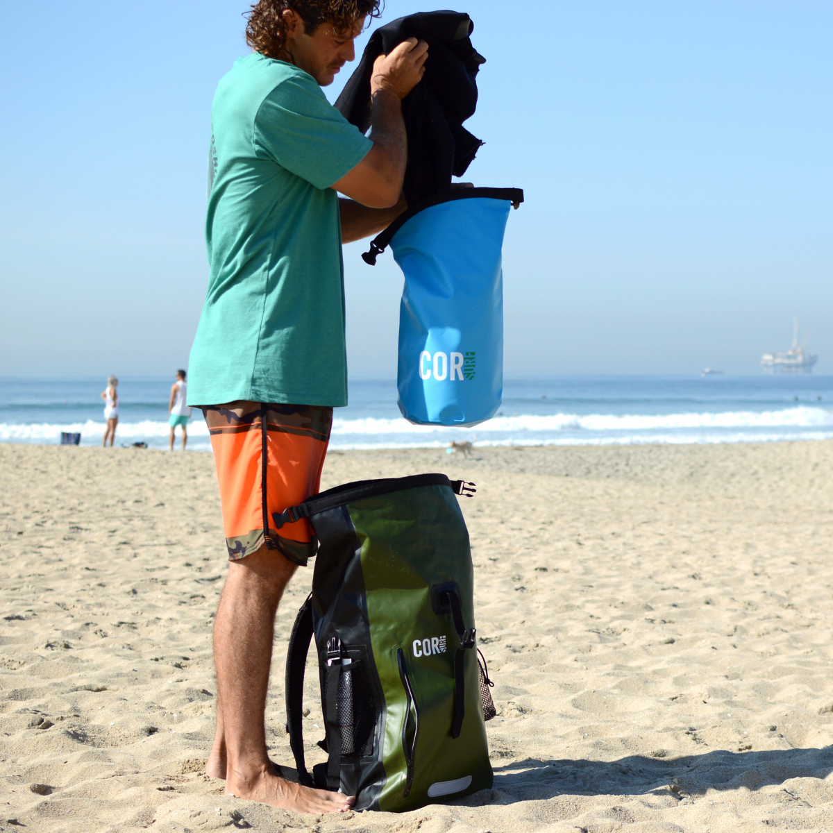 Person on a beach with COR bags