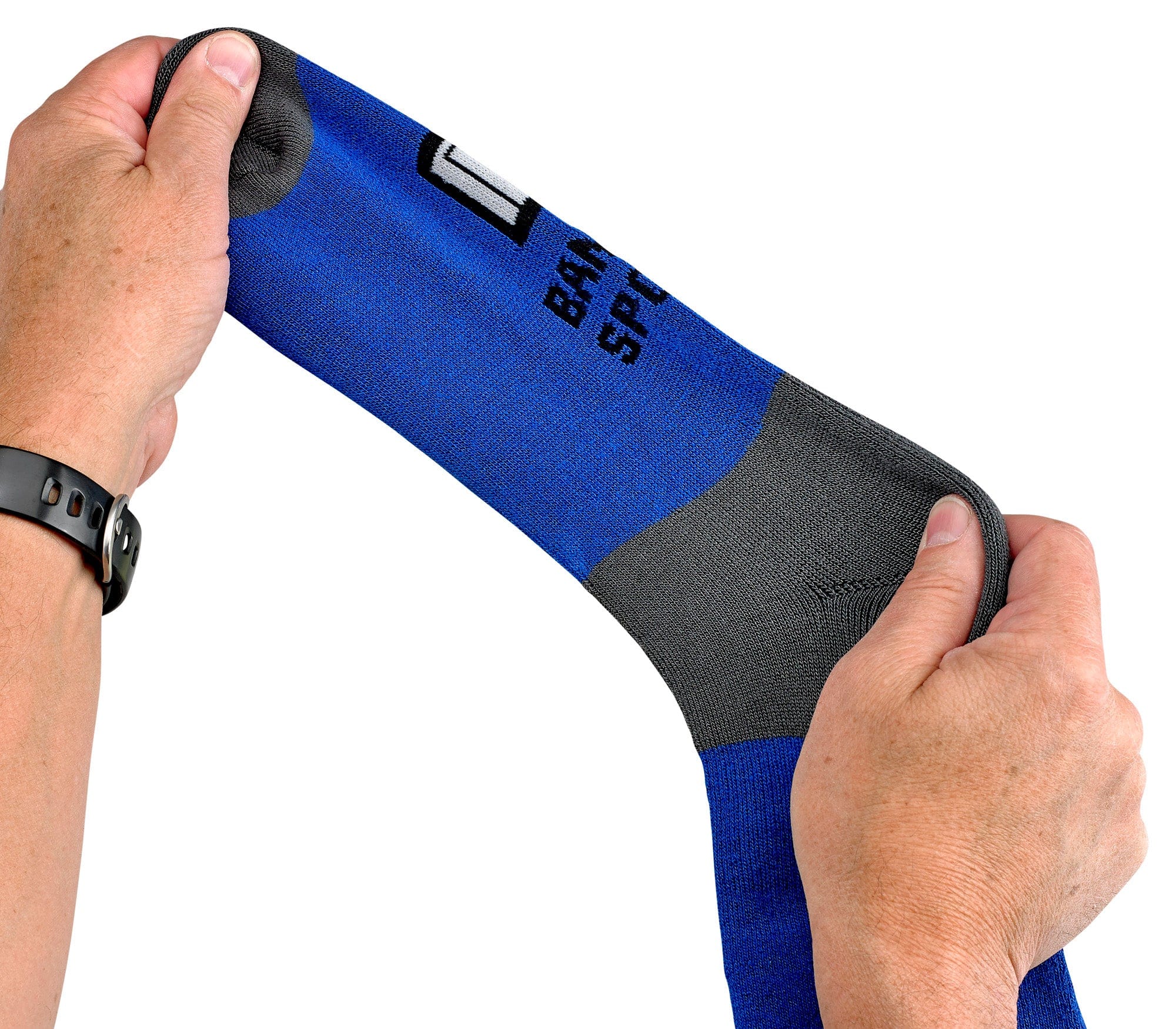 Blue and black sock held by a hand on a white background