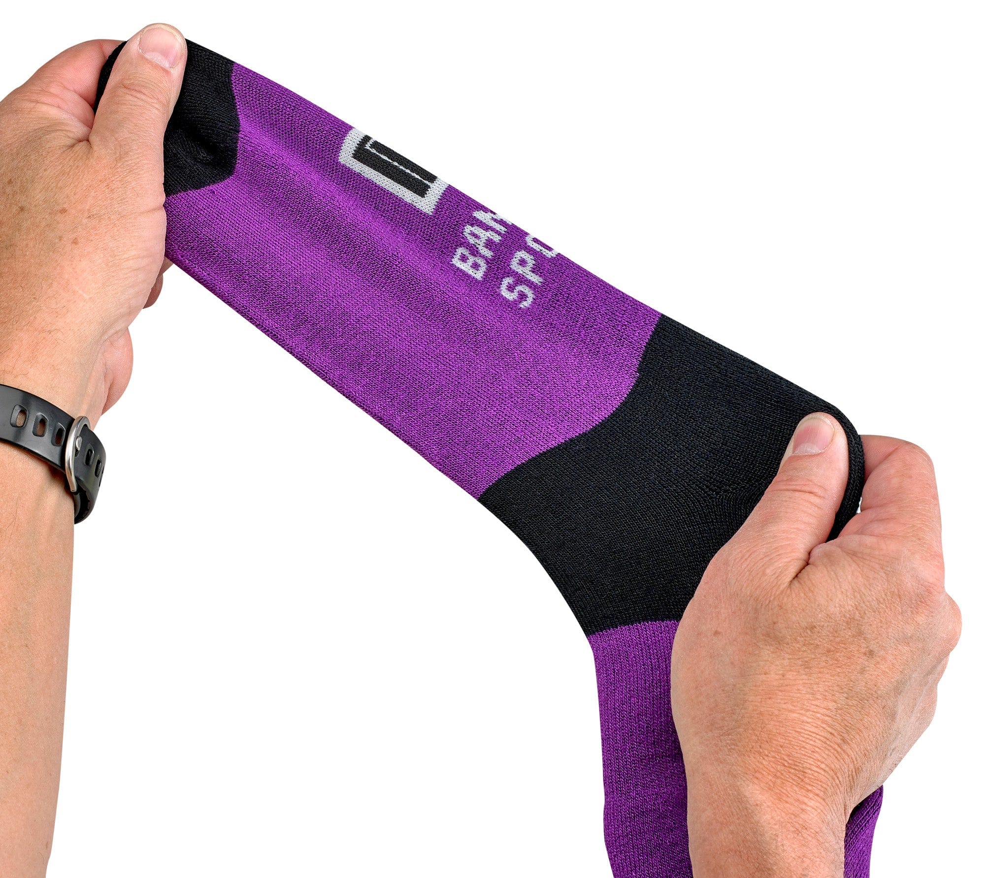 Purple and black sock being held by a person on a white background